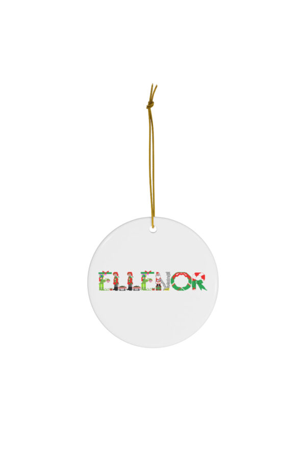 White ceramic ornament with text ‘Ellenor’ in colourful Christmas themed lettering, with gold hanging loop