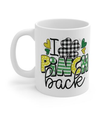 White 11 ounce mug, featuring the phrase ‘I Pinch Back’ with a shamrock in black, green, and gold