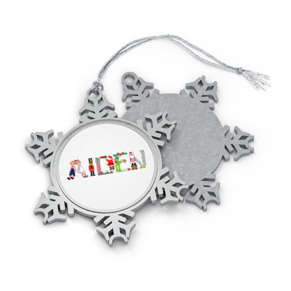 Silver-toned snowflake ornament with white insert with text ‘Aiden’ in colourful Christmas themed lettering, with silver hanging loop