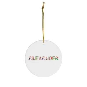 White ceramic ornament with text ‘Alexander’ in colourful Christmas themed lettering, with gold hanging loop