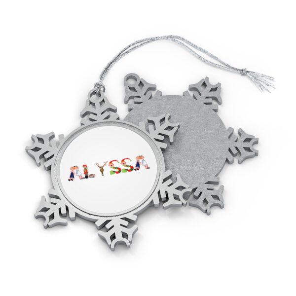 Silver-toned snowflake ornament with white insert with text ‘Alyssa’ in colourful Christmas themed lettering, with silver hanging loop