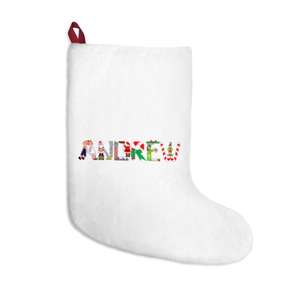 White stocking with text ‘Andrew’ in colourful Christmas themed lettering, with red hanging loop