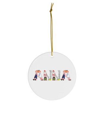 White ceramic ornament with text ‘Anna’ in colourful Christmas themed lettering, with gold hanging loop