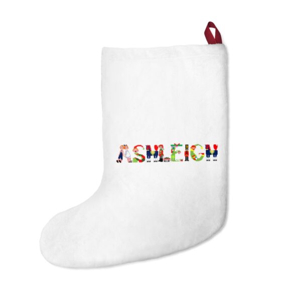 White stocking with text ‘Ashleigh’ in colourful Christmas themed lettering, with red hanging loop