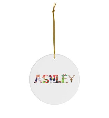White ceramic ornament with text ‘Ashley’ in colourful Christmas themed lettering, with gold hanging loop