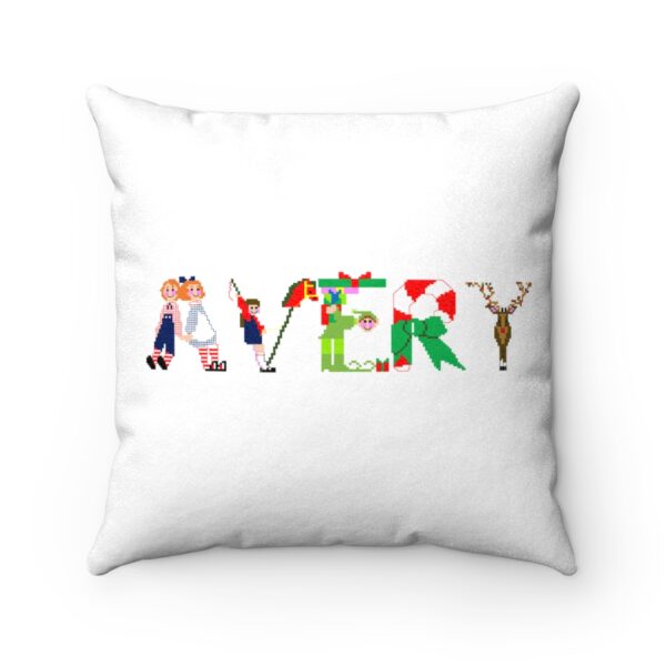 White faux suede cushion with text ‘Avery’ in colourful Christmas themed lettering
