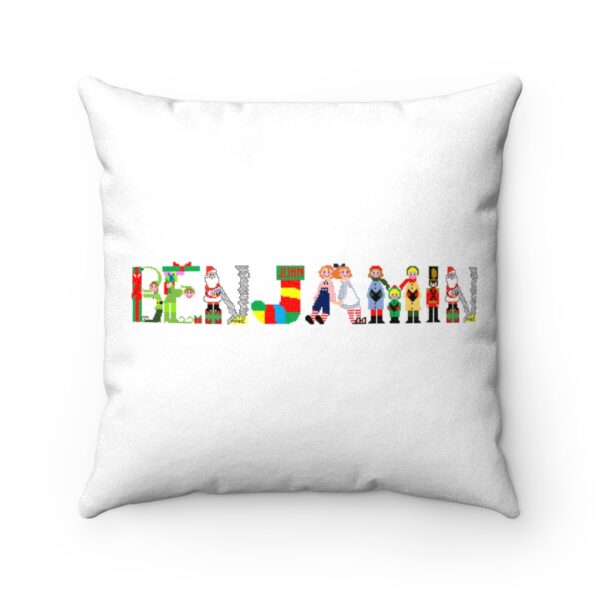 White faux suede cushion with text ‘Benjamin’ in colourful Christmas themed lettering