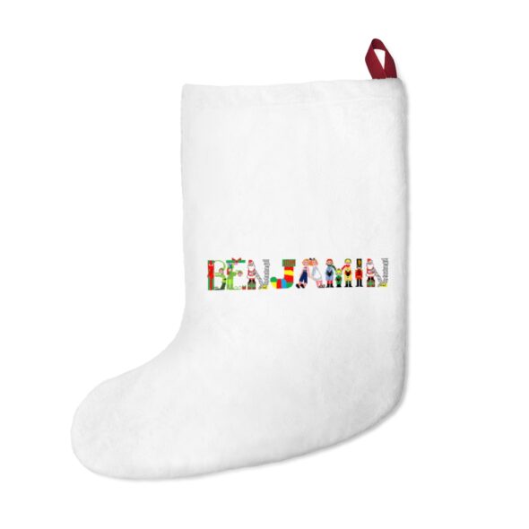 White stocking with text ‘Benjamin’ in colourful Christmas themed lettering, with red hanging loop
