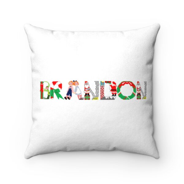 White faux suede cushion with text ‘Brandon’ in colourful Christmas themed lettering