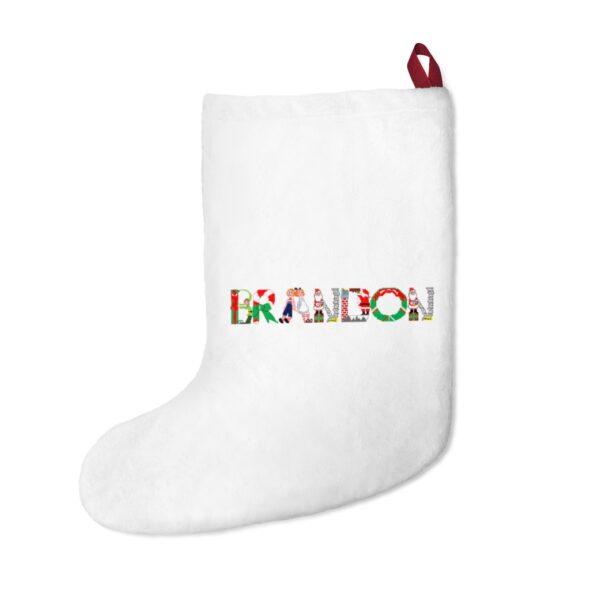 White stocking with text ‘Brandon’ in colourful Christmas themed lettering, with red hanging loop