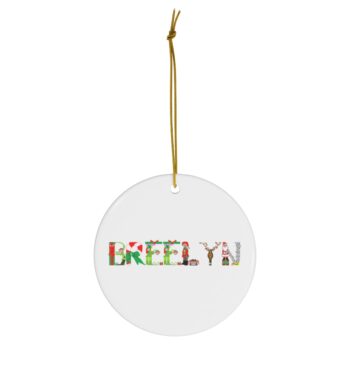 White ceramic ornament with text ‘Breelyn’ in colourful Christmas themed lettering, with gold hanging loop