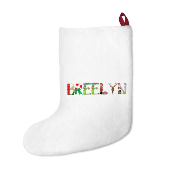 White stocking with text ‘Breelyn’ in colourful Christmas themed lettering, with red hanging loop