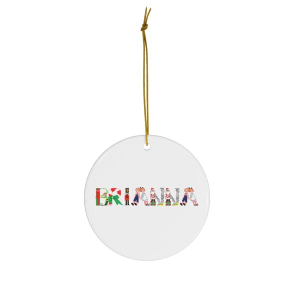 White ceramic ornament with text ‘Brianna’ in colourful Christmas themed lettering, with gold hanging loop