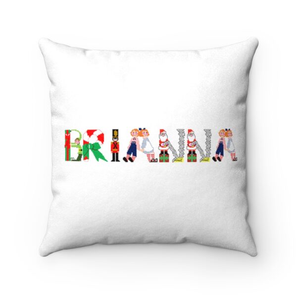 White faux suede cushion with text ‘Brianna’ in colourful Christmas themed lettering