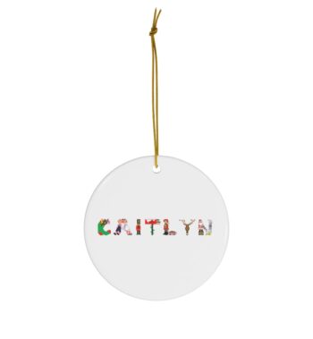 White ceramic ornament with text ‘Caitlyn’ in colourful Christmas themed lettering, with gold hanging loop