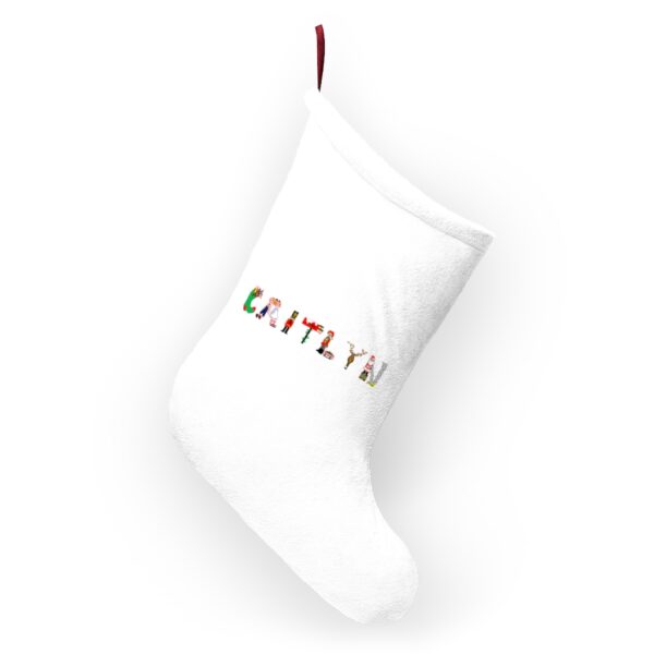 White stocking with text ‘Caitlyn’ in colourful Christmas themed lettering, with red hanging loop
