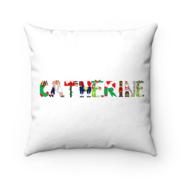 White faux suede cushion with text ‘Catherine’ in colourful Christmas themed lettering