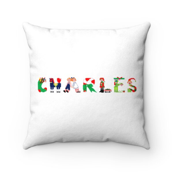 White faux suede cushion with text ‘Charles’ in colourful Christmas themed lettering