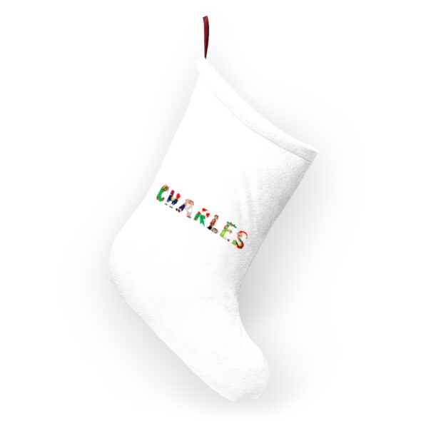 White stocking with text ‘Charles’ in colourful Christmas themed lettering, with red hanging loop