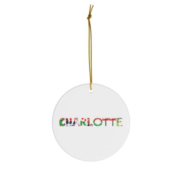 White ceramic ornament with text ‘Charlotte’ in colourful Christmas themed lettering, with gold hanging loop
