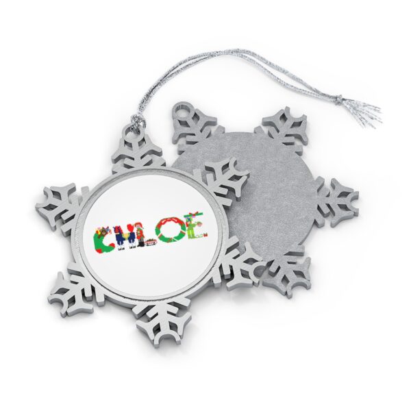 Silver-toned snowflake ornament with white insert with text ‘Chloe’ in colourful Christmas themed lettering, with silver hanging loop