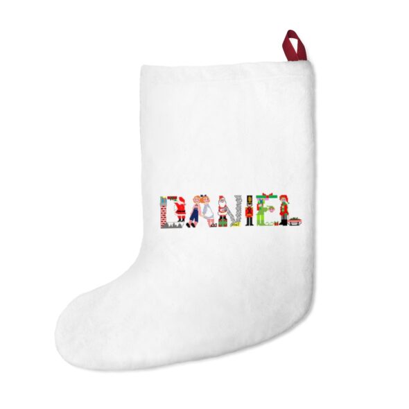 White stocking with text ‘Daniel’ in colourful Christmas themed lettering, with red hanging loop