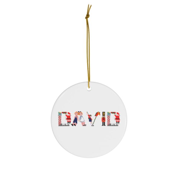 White ceramic ornament with text ‘David’ in colourful Christmas themed lettering, with gold hanging loop