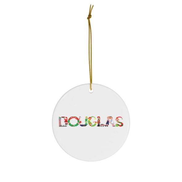 White ceramic ornament with text ‘Douglas’ in colourful Christmas themed lettering, with gold hanging loop