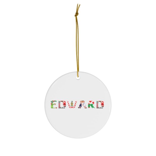 White ceramic ornament with text ‘Edward’ in colourful Christmas themed lettering, with gold hanging loop