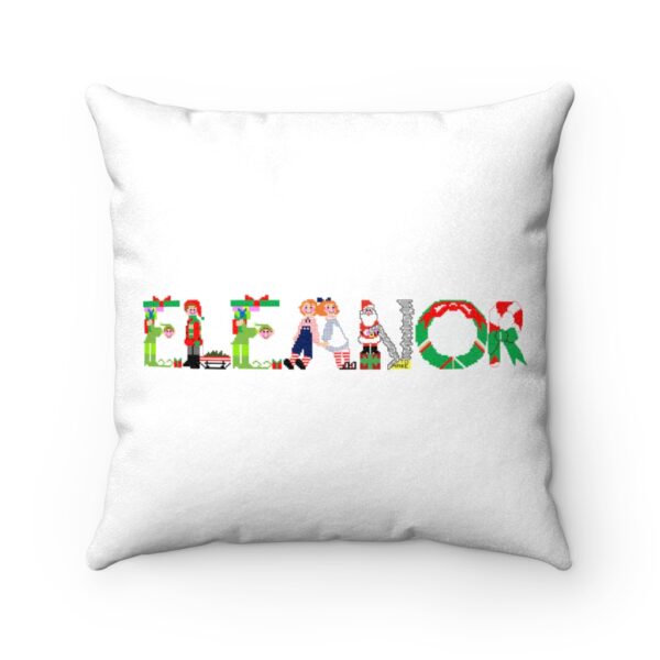 White faux suede cushion with text ‘Eleanor’ in colourful Christmas themed lettering