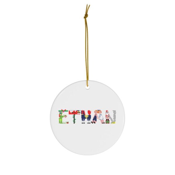 White ceramic ornament with text ‘Ethan’ in colourful Christmas themed lettering, with gold hanging loop