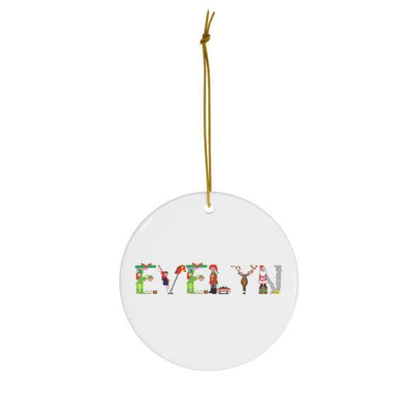 White ceramic ornament with text ‘Evelyn’ in colourful Christmas themed lettering, with gold hanging loop