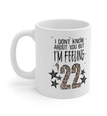 White 11 ounce mug, featuring the lyric ‘I don’t know about you but I’m Feelin’ ‘22’ with the ’22 in leopard print