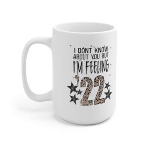White 15 ounce mug, featuring the lyric ‘I don’t know about you but I’m Feelin’ ‘22’ with the ’22 in leopard print