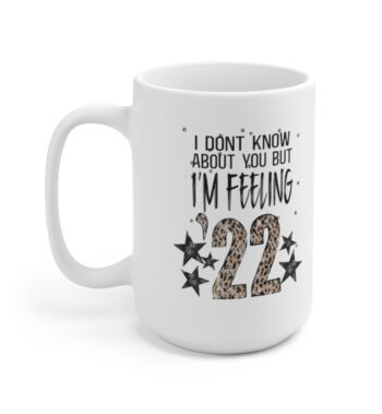 White 15 ounce mug, featuring the lyric ‘I don’t know about you but I’m Feelin’ ‘22’ with the ’22 in leopard print