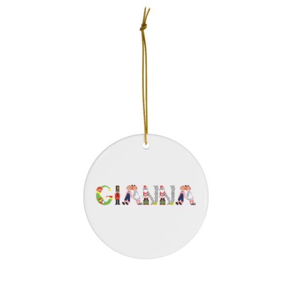 White ceramic ornament with text ‘Gianna’ in colourful Christmas themed lettering, with gold hanging loop