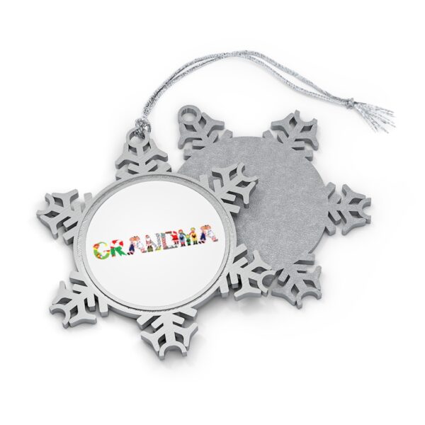 Silver-toned snowflake ornament with white insert with text ‘Grandma’ in colourful Christmas themed lettering, with silver hanging loop