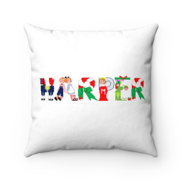 White faux suede cushion with text ‘Harper’ in colourful Christmas themed lettering