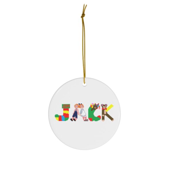 White ceramic ornament with text ‘Jack’ in colourful Christmas themed lettering, with gold hanging loop