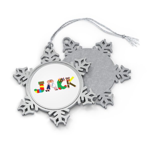 Silver-toned snowflake ornament with white insert with text ‘Jack’ in colourful Christmas themed lettering, with silver hanging loop