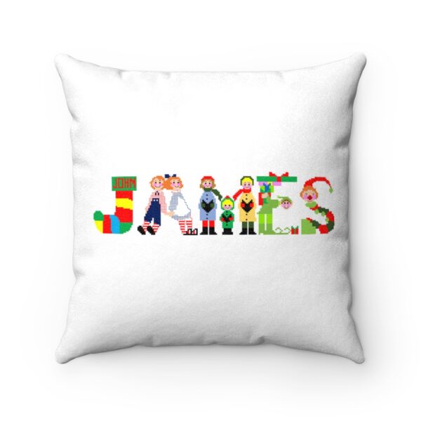 White faux suede cushion with text ‘James’ in colourful Christmas themed lettering