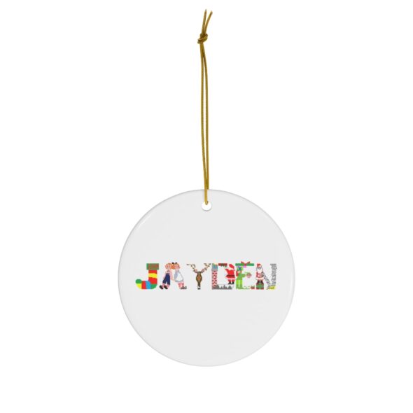 White ceramic ornament with text ‘Jayden’ in colourful Christmas themed lettering, with gold hanging loop
