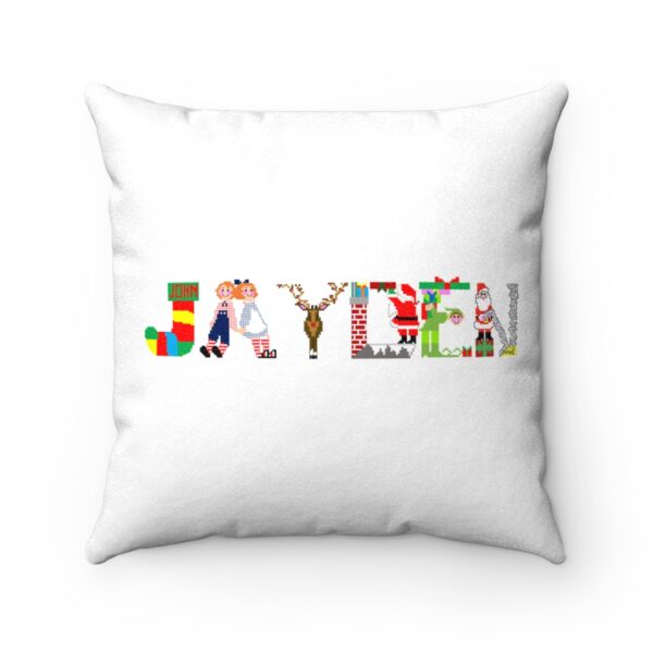 White faux suede cushion with text ‘Jayden’ in colourful Christmas themed lettering