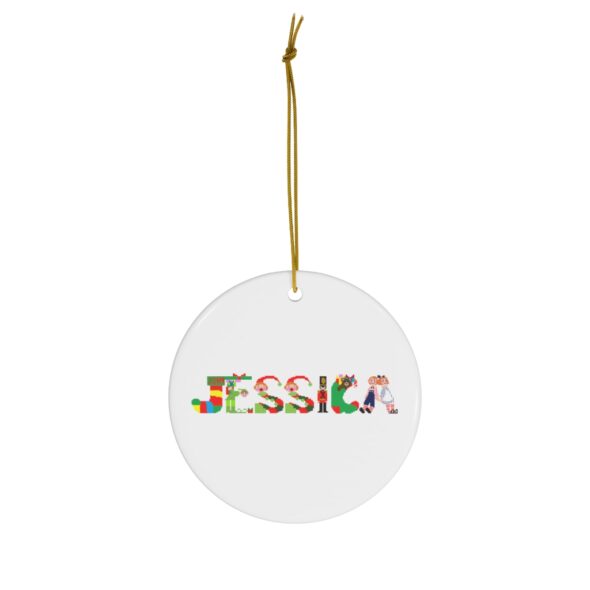 White ceramic ornament with text ‘Jessica’ in colourful Christmas themed lettering, with gold hanging loop