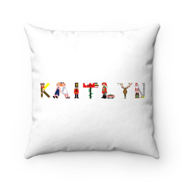 White faux suede cushion with text ‘Kaitlyn’ in colourful Christmas themed lettering