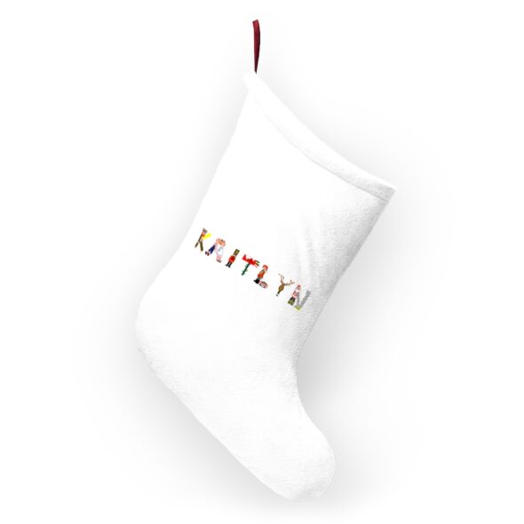 White stocking with text ‘Kaitlyn’ in colourful Christmas themed lettering, with red hanging loop
