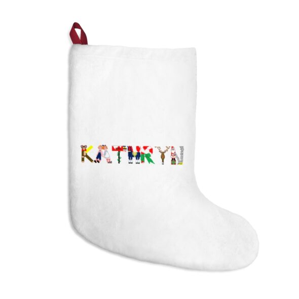 White stocking with text ‘Kathryn’ in colourful Christmas themed lettering, with red hanging loop