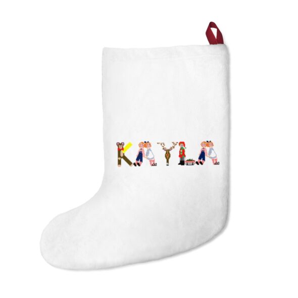 White stocking with text ‘Kayla’ in colourful Christmas themed lettering, with red hanging loop