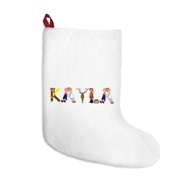 White stocking with text ‘Kayla’ in colourful Christmas themed lettering, with red hanging loop