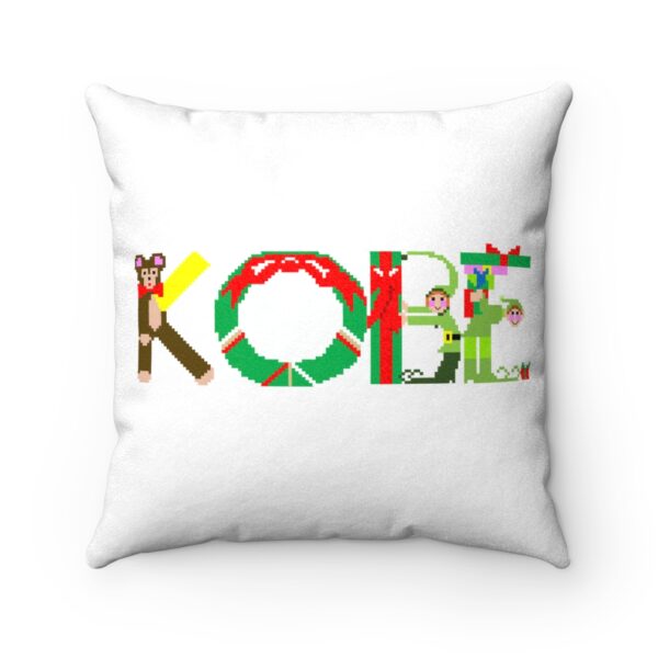 White faux suede cushion with text ‘Kobe’ in colourful Christmas themed lettering